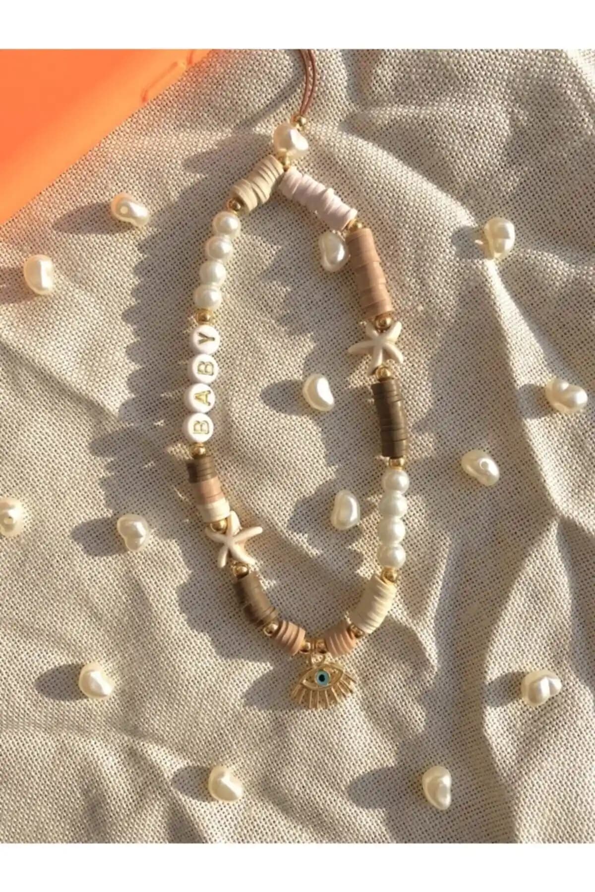 Moshi Tasarımlı Fimo Boncuk Telefon Askısı Apple Marka Telefonlar İçin Güvenli ve Şık Bir Aksesuar